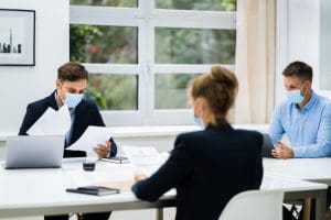 employees at a board table